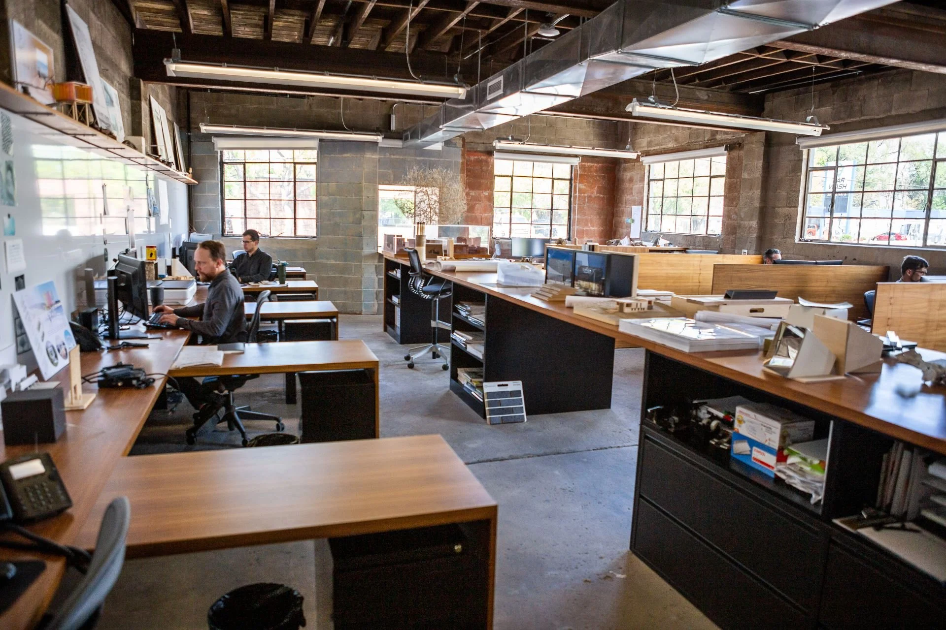 Salt Lake City renovated studio office with shared desks designed by Sparano + Mooney Architecture