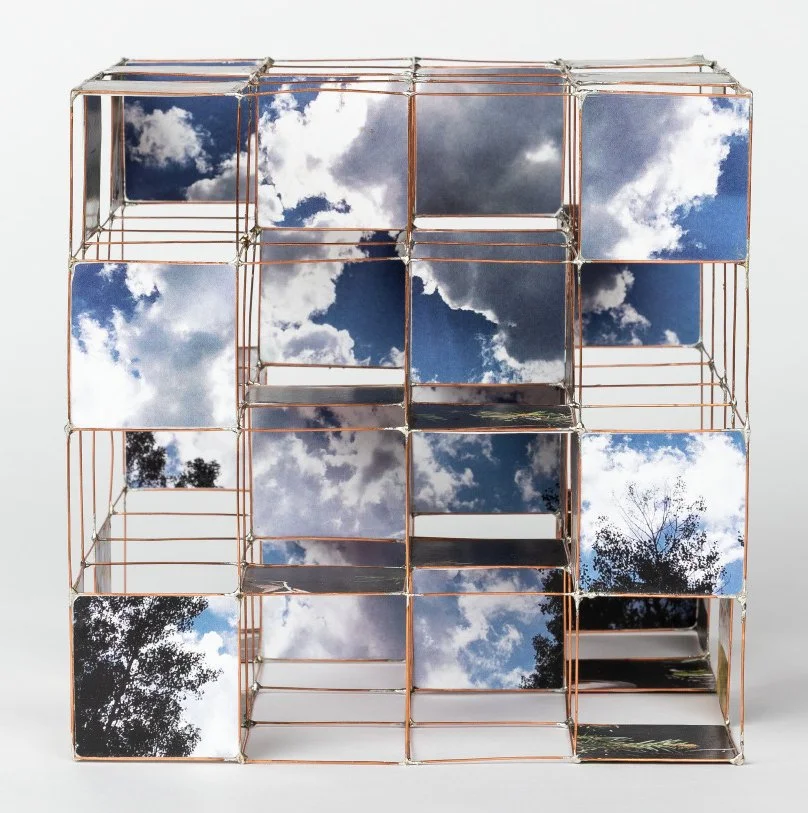 Nest heuristic device, multi-sided gridded model with layered images of a cloudy sky by Sparano + Mooney Architecture