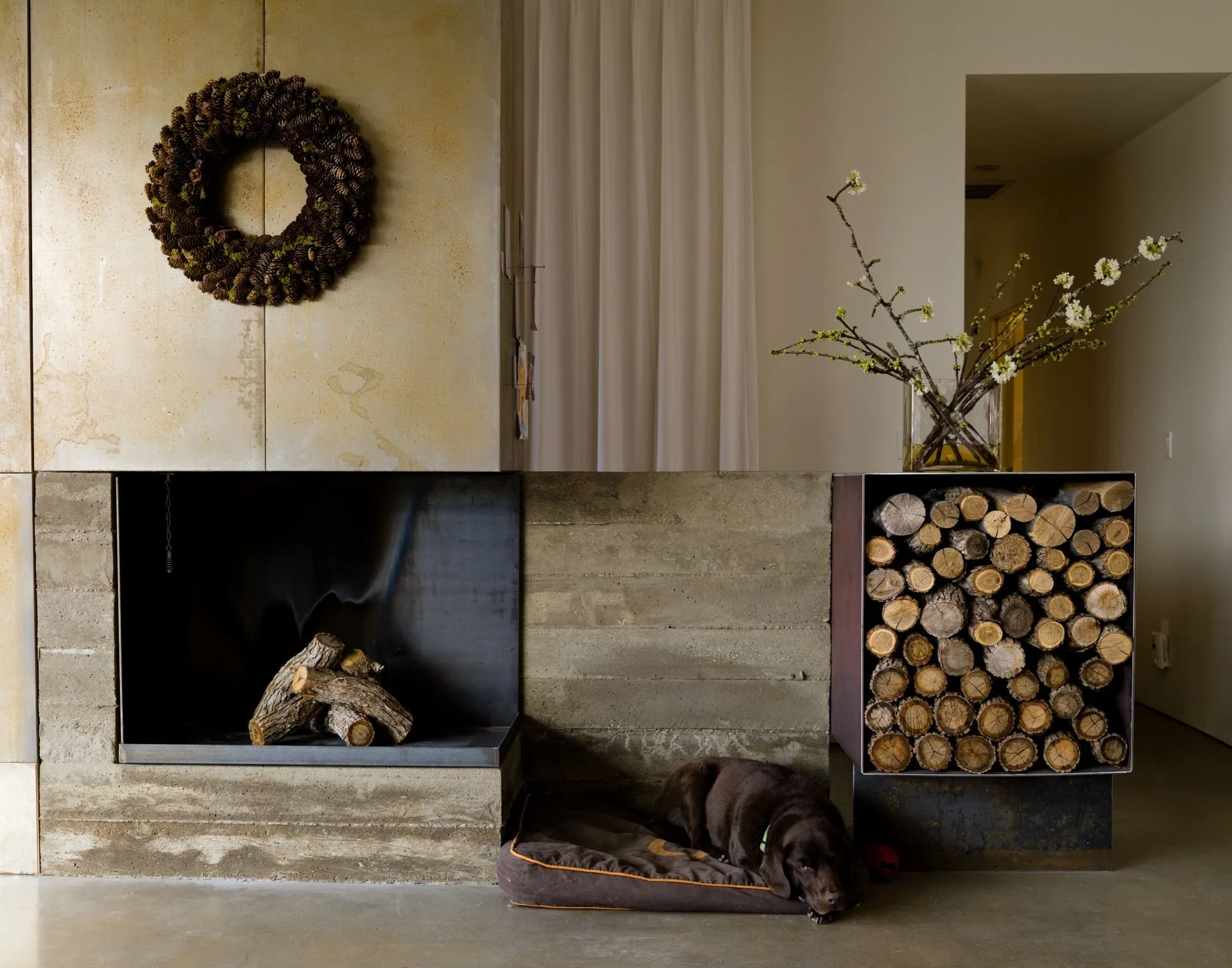 Contemporary concrete and steel fireplace in canyon house designed by Sparano + Mooney Architecture