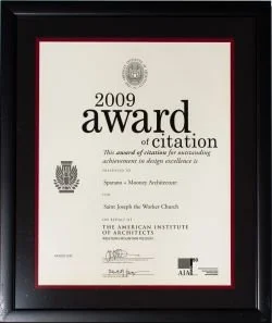 A framed certificate titled '2009 Award Citation' awarded to Moses Abrahamson for excellence in design, signed and issued by the American Institute of Architects.