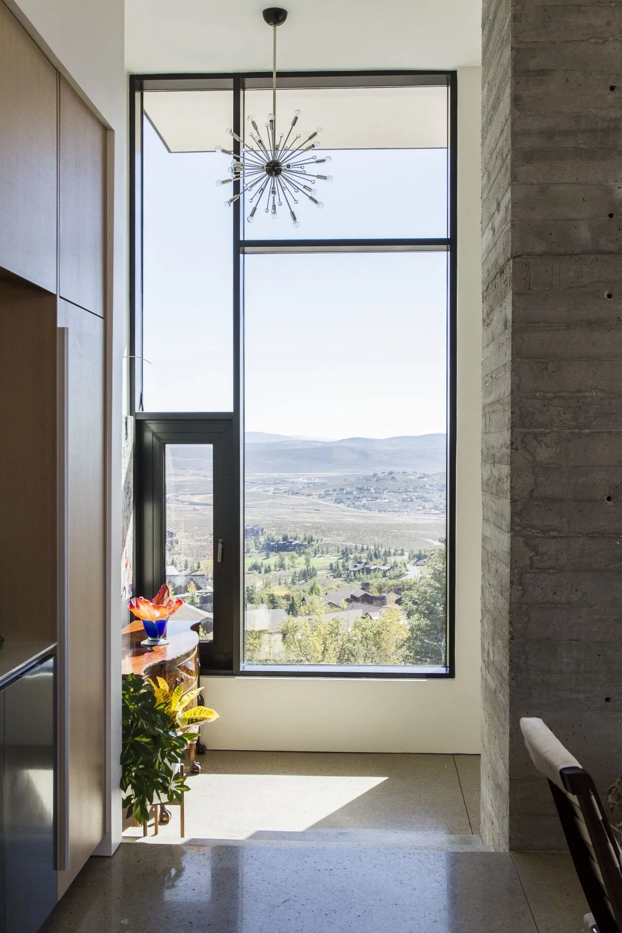 Kitchen perspective of expansive window overlooking Park City designed by Sparano + Mooney Architecture