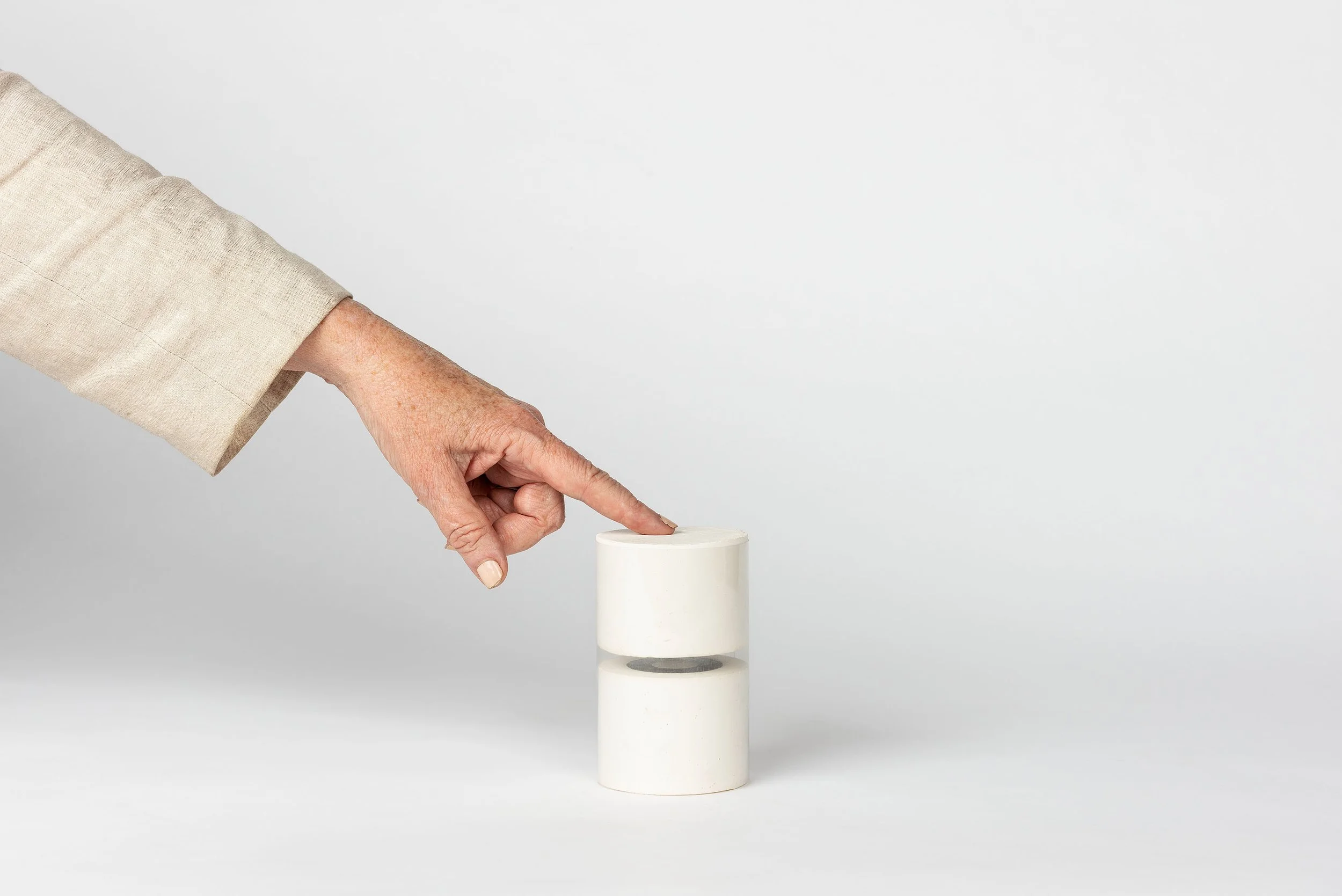 Buddhist Hermitage heuristic device of white plaster cylinders with magnets resisting each other in between, designed by Sparano + Mooney Architecture