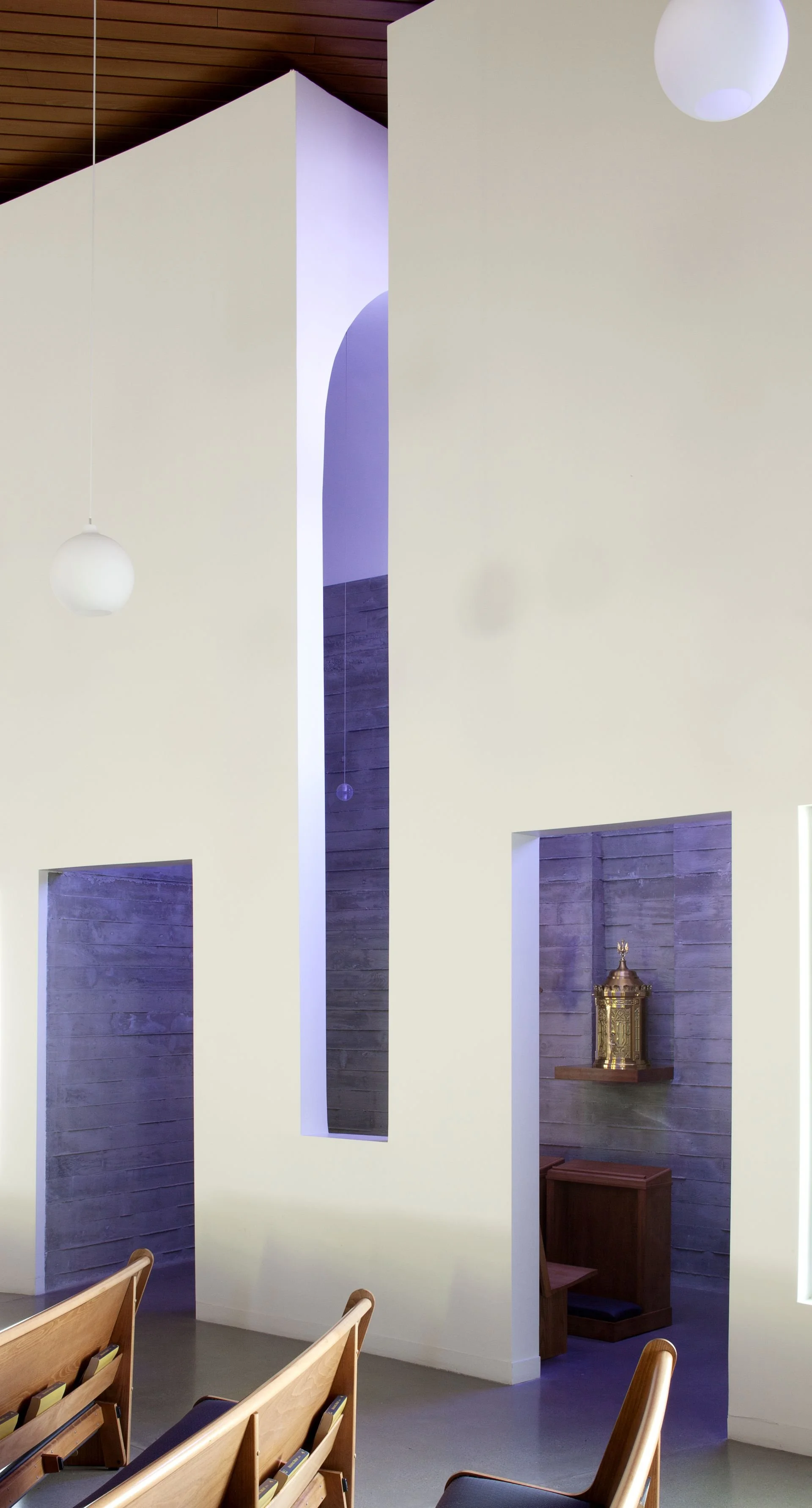 Glowing purple tabernacle with large linear openings in Utah Church designed by Sparano + Mooney Architecture