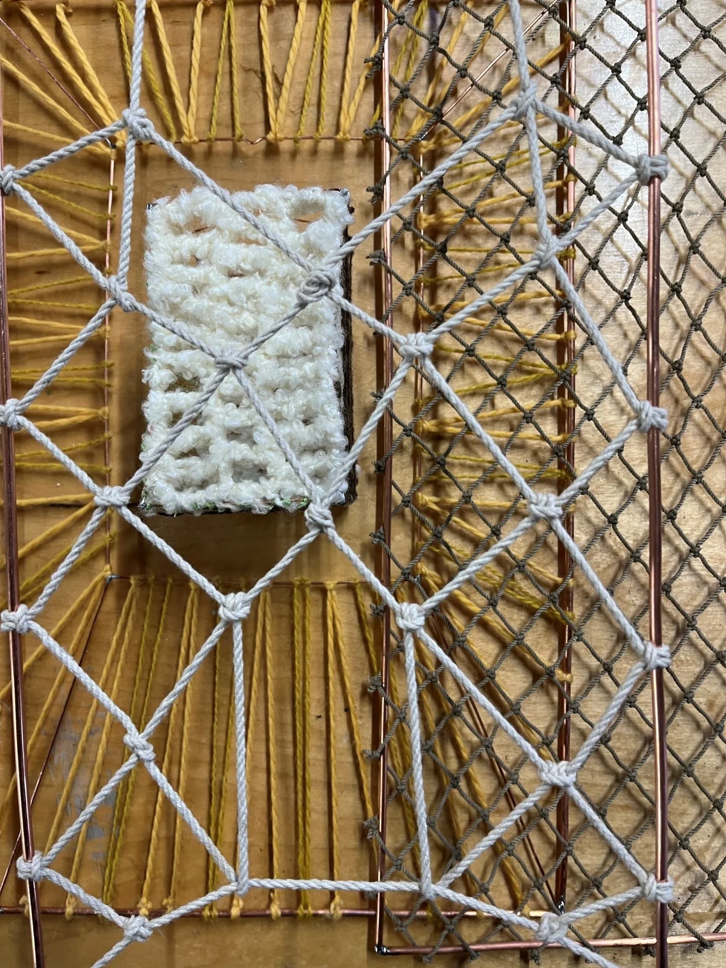 Interlaken mobile heuristic device with overlapping layers of yarn screens, designed by Sparano + Mooney Architecture