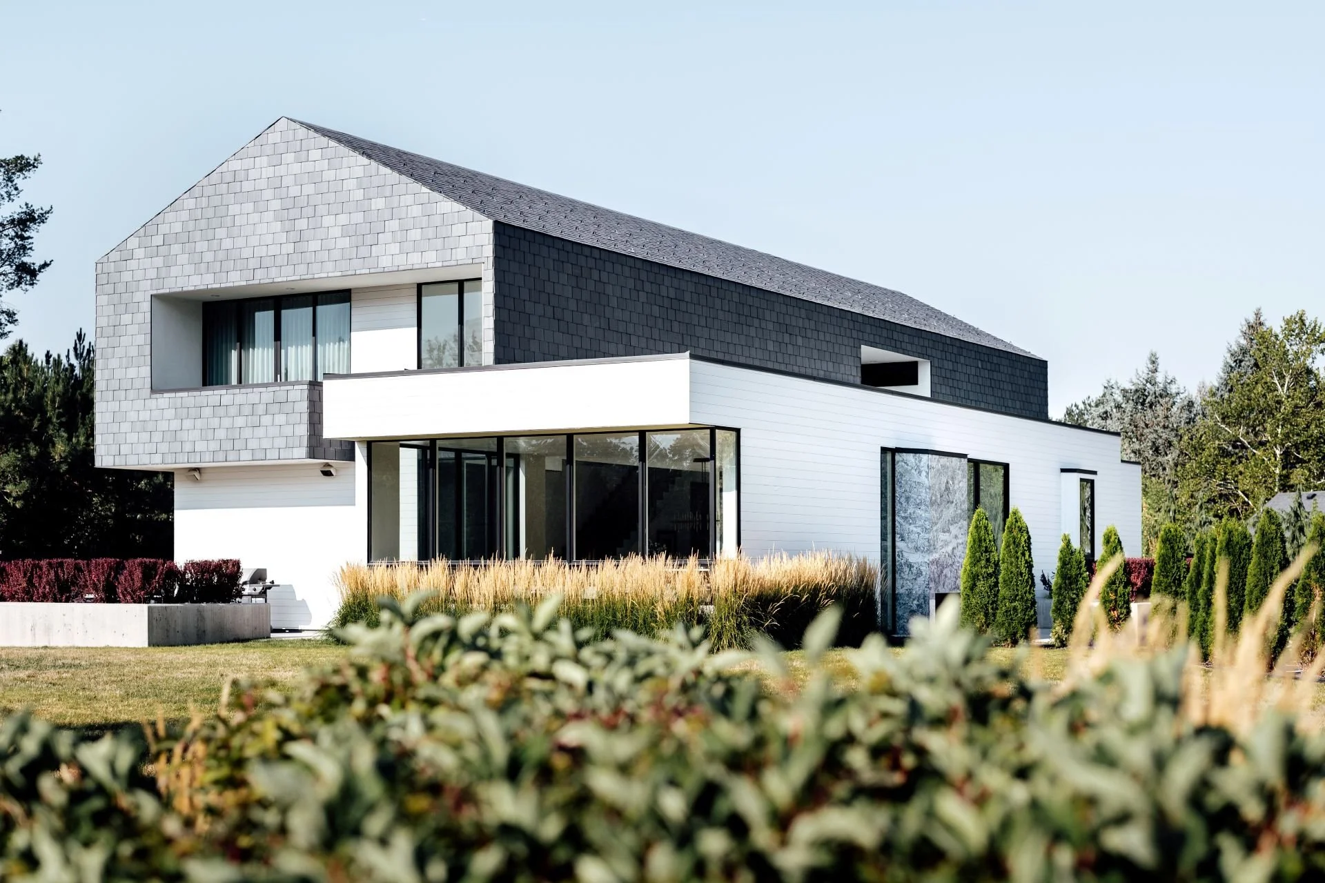 Perspective of undulating slate shingle and white cedar facade designed by Sparano + Mooney Architecture