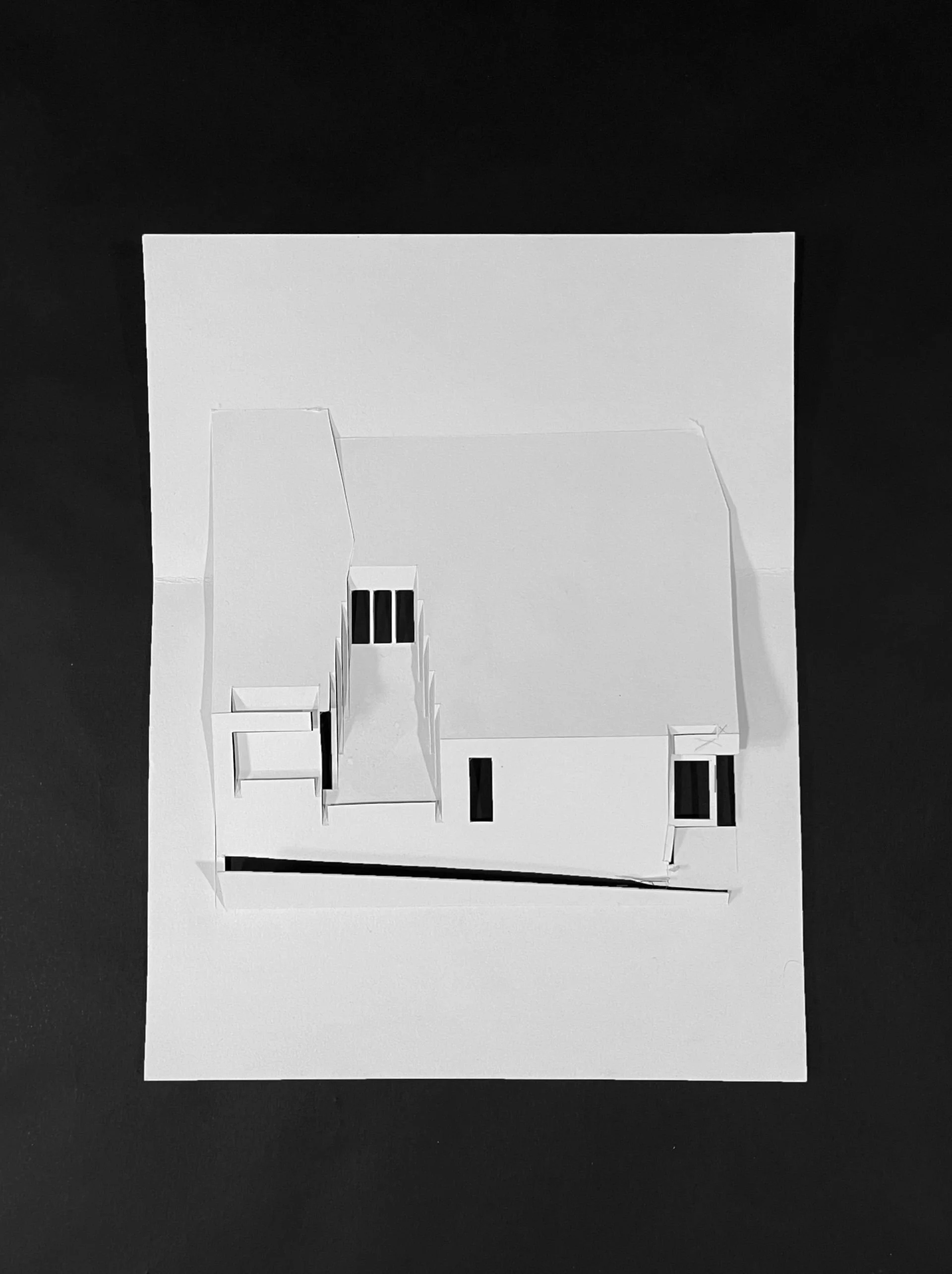 Kirigami concept model of unfolded flattened paper building mass designed Sparano + Mooney Architecture