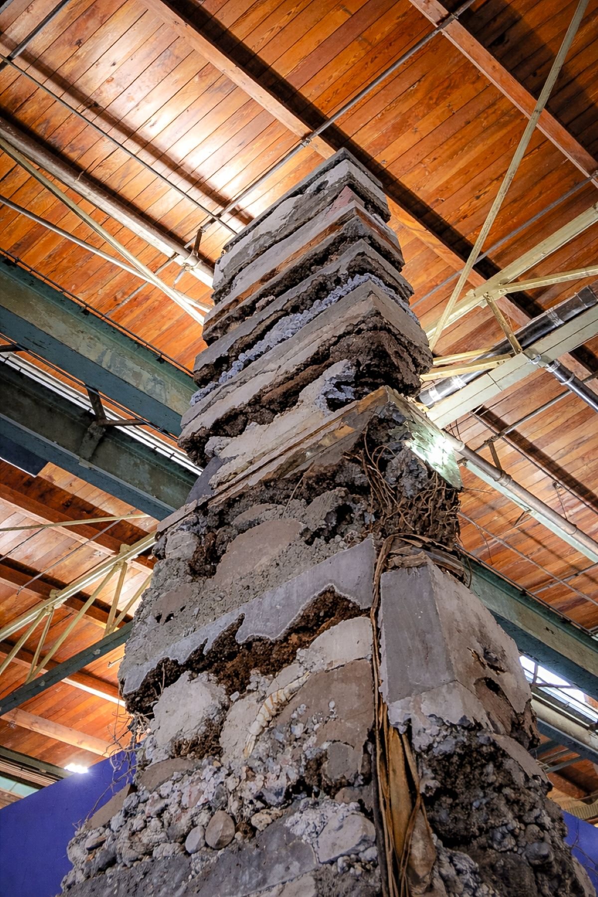 Adrian Villar Rojas large site specific installation tower made with natural found material designed by Sparano + Mooney Architecture