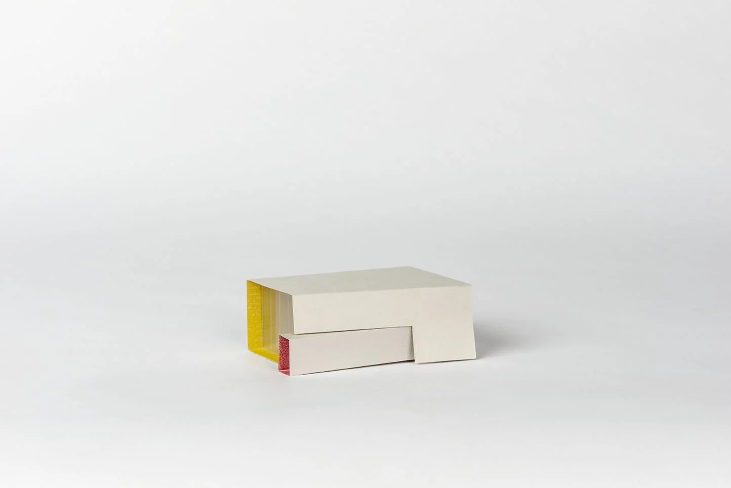 NEHMA study model, white massing with large transparent face with red and yellow internal color details designed by Sparano + Mooney Architecture