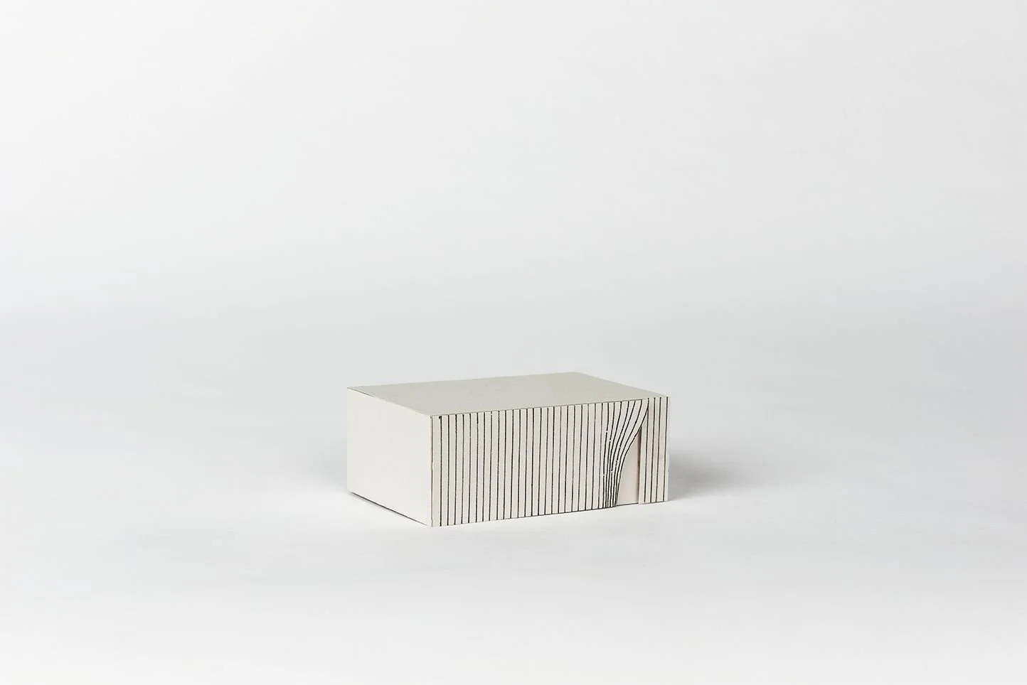 NEHMA study model, white massing with black vertical stripes along one of the building faces designed by Sparano + Mooney Architecture