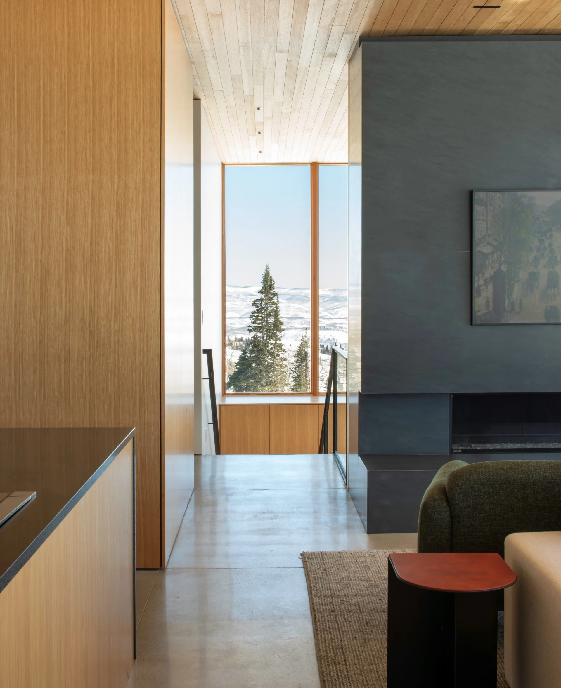 View from Kirigami living room with cedar paneled walls and mountain views designed by Sparano + Mooney Architecture