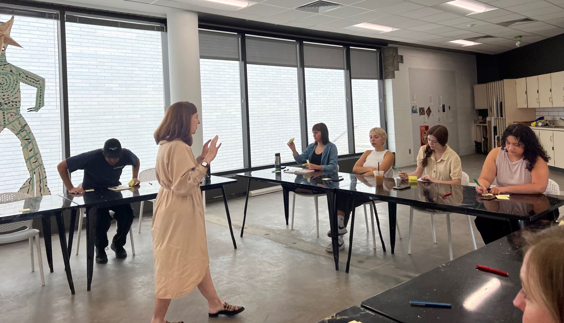 Anne Mooney leading listening session to young adults about the next phase of UMOCA designed by Sparano + Mooney Architecture