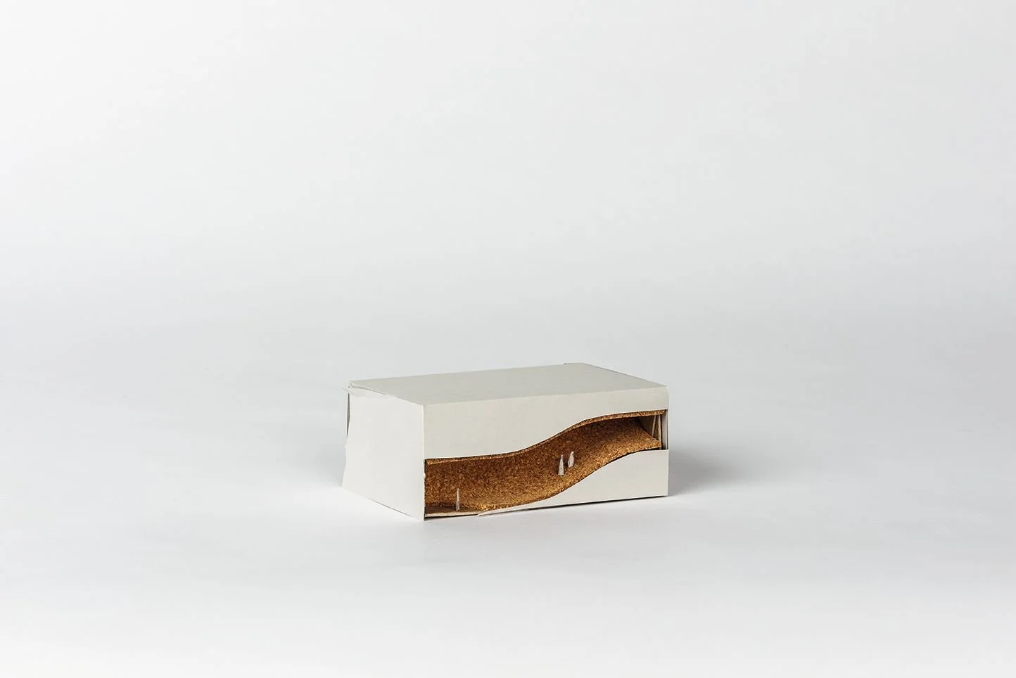 NEHMA study model, white massing with exposed cork vertical circulation designed by Sparano + Mooney Architecture