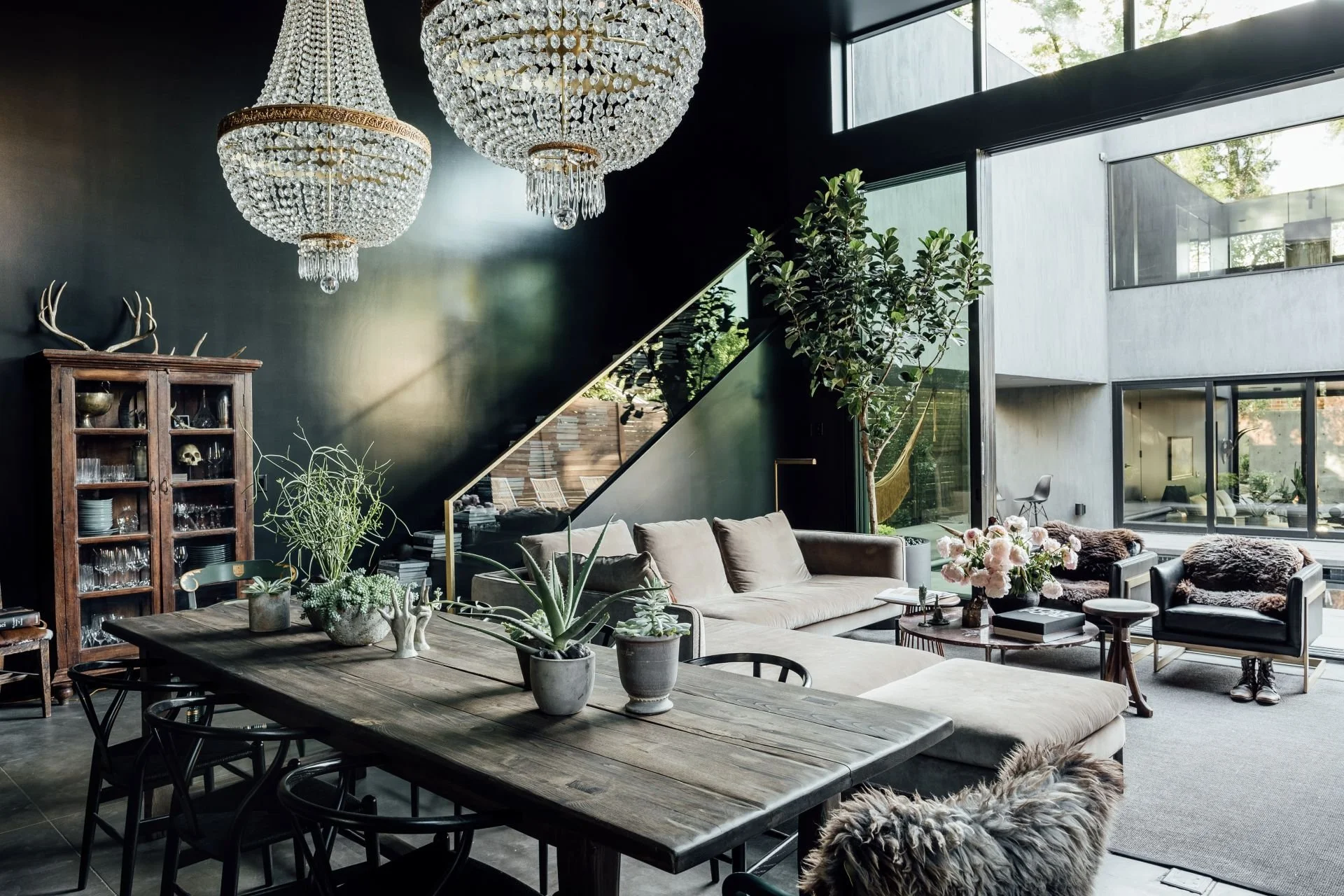 Urban Treehouse residence dining and living room with dark green walls designed by Sparano + Mooney Architecture