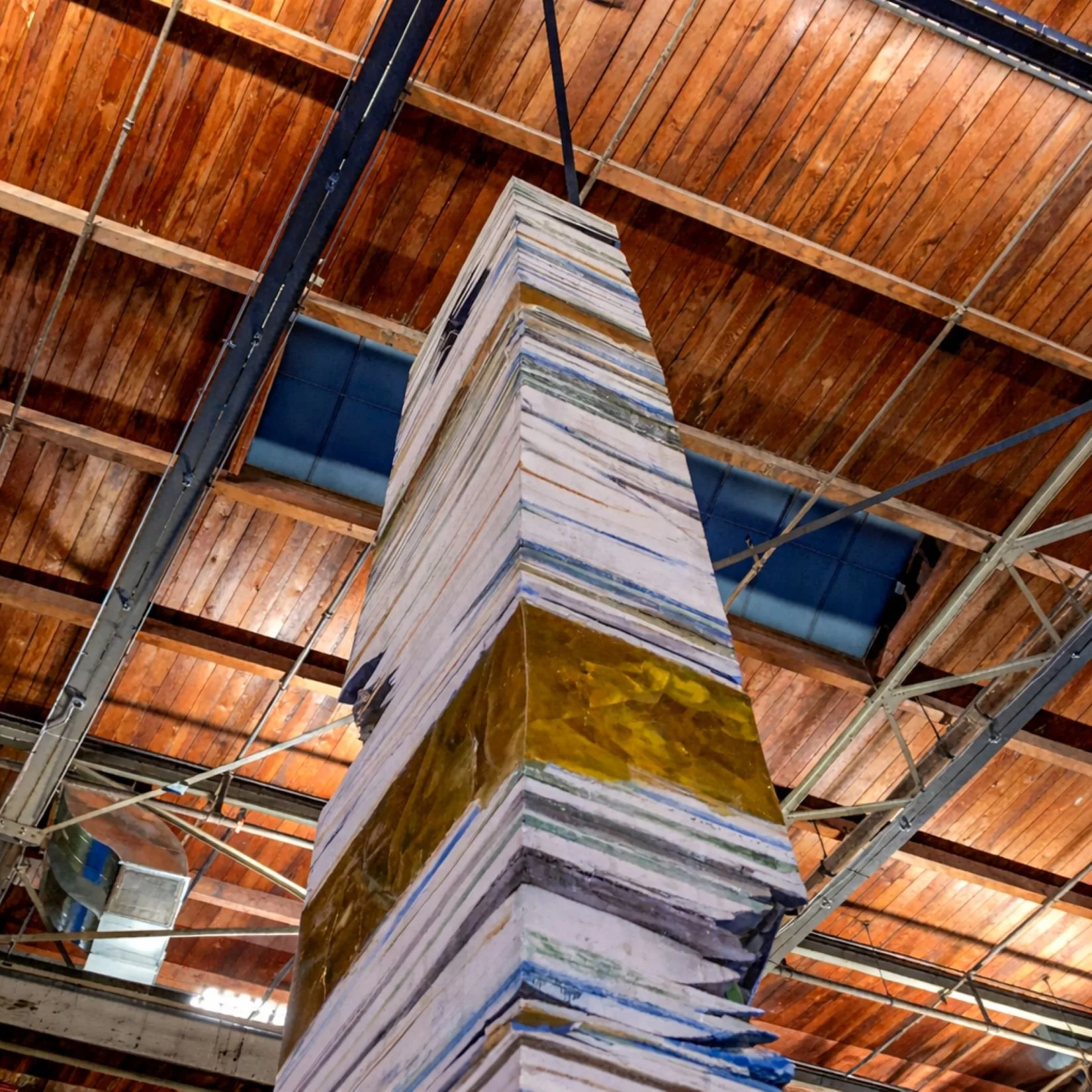 Adrian Villar Rojas MoCA installation of tall stacked column of found objects designed by Sparano + Mooney Architecture