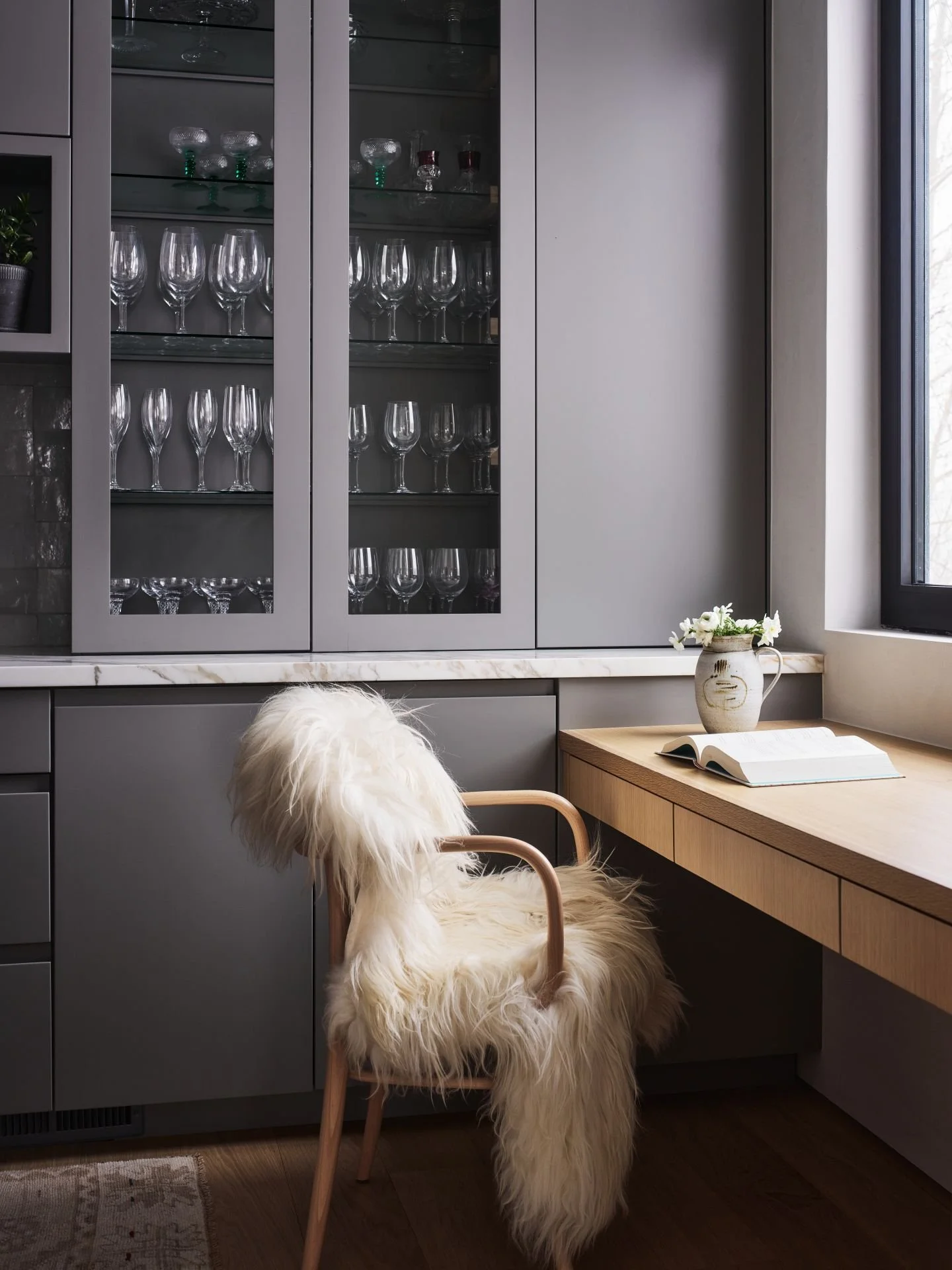 Park City Nest Residence built in wood desk with fur and wood chair designed by Sparano + Mooney Architecture