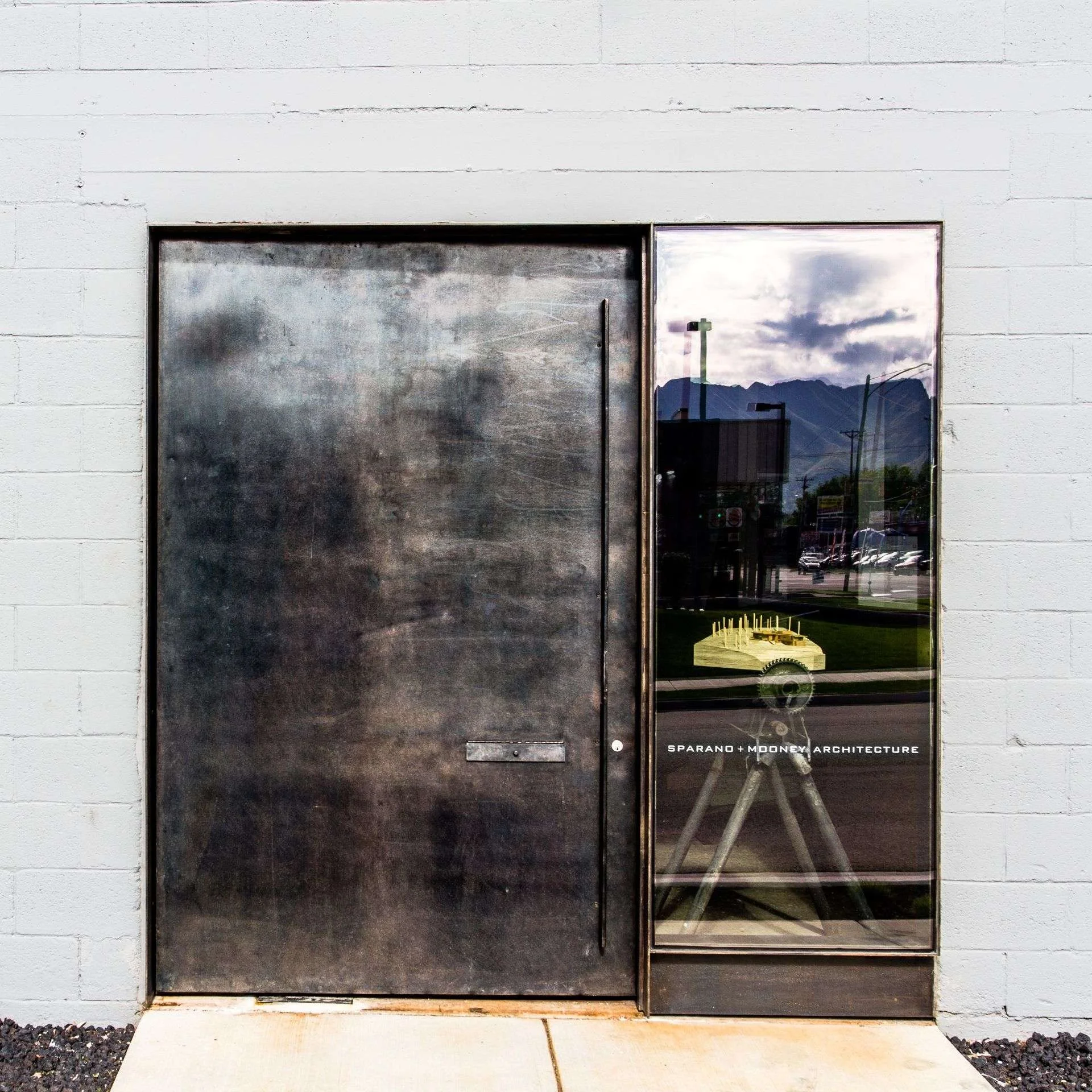 Modern steel entrance door for office renovation designed by Sparano + Mooney Architecture