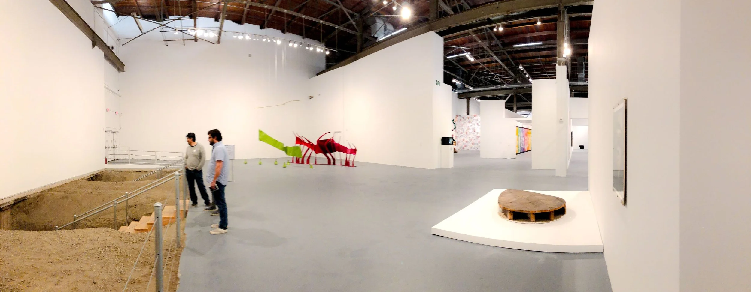 Wide lens installation view MoCA California expansive gallery with excavation pit designed by Sparano + Mooney Architecture