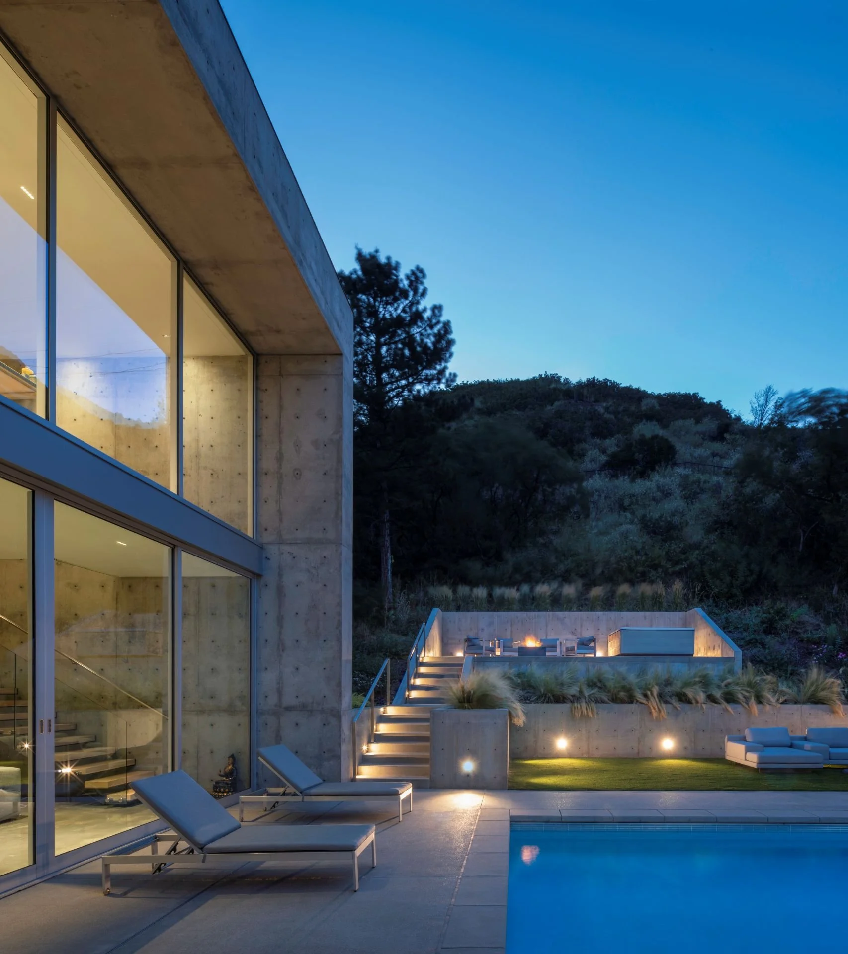Contemporary cube residence exterior with glazing and pool designed by Sparano + Mooney Architecture