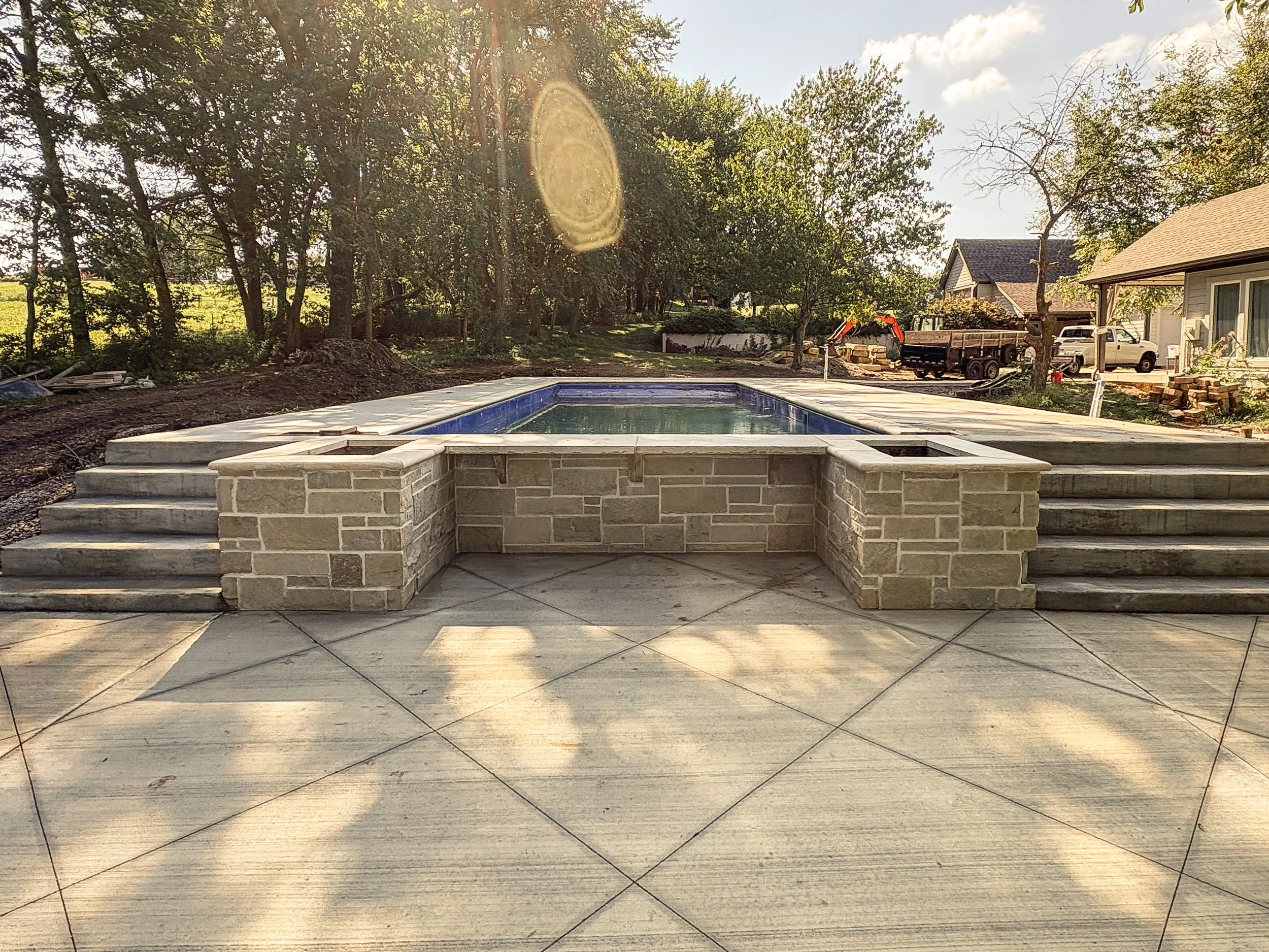 Architectural Pool Stone Veneer in Kansas City

Elevate your poolside experience with master installed architectural stone veneer. Applying precision cut stone to raised pool walls, sheer descent water features, and retaining borders creates a striki