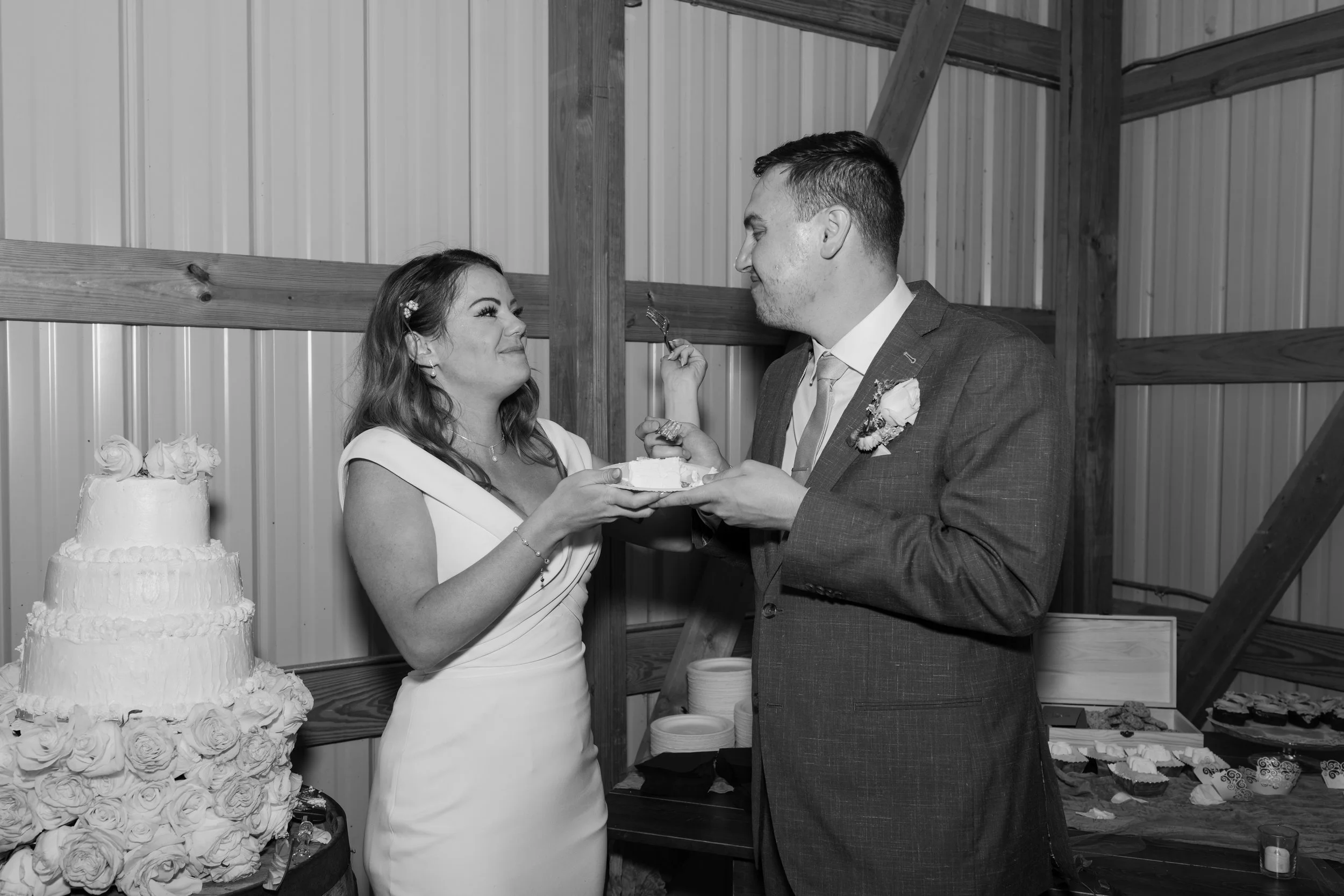 A bride and groom are sharing a moment at their wedding reception at Everett Ranch in Salida, Colorado.