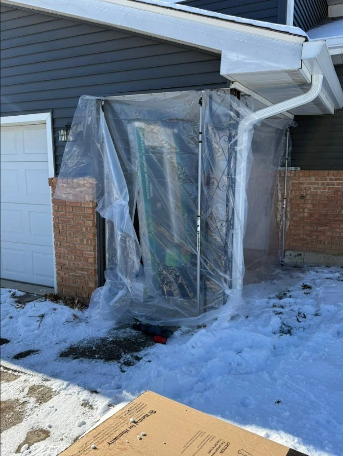 Winter door install, with the opening protected from the weather