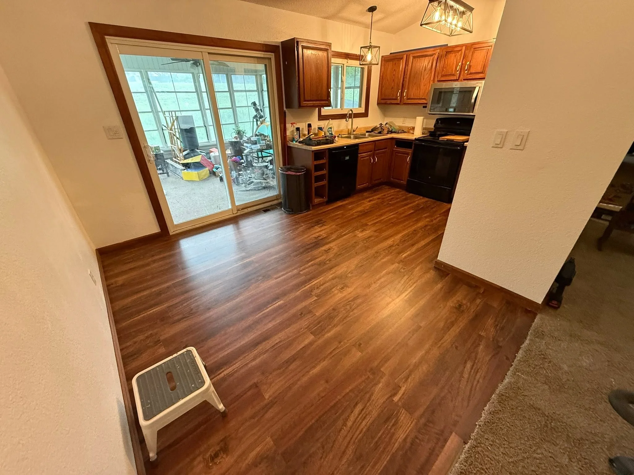 New floor carried from the dining area into the kitchen