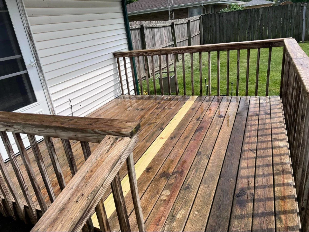 Deck board replacement — new boards fitted into an existing deck