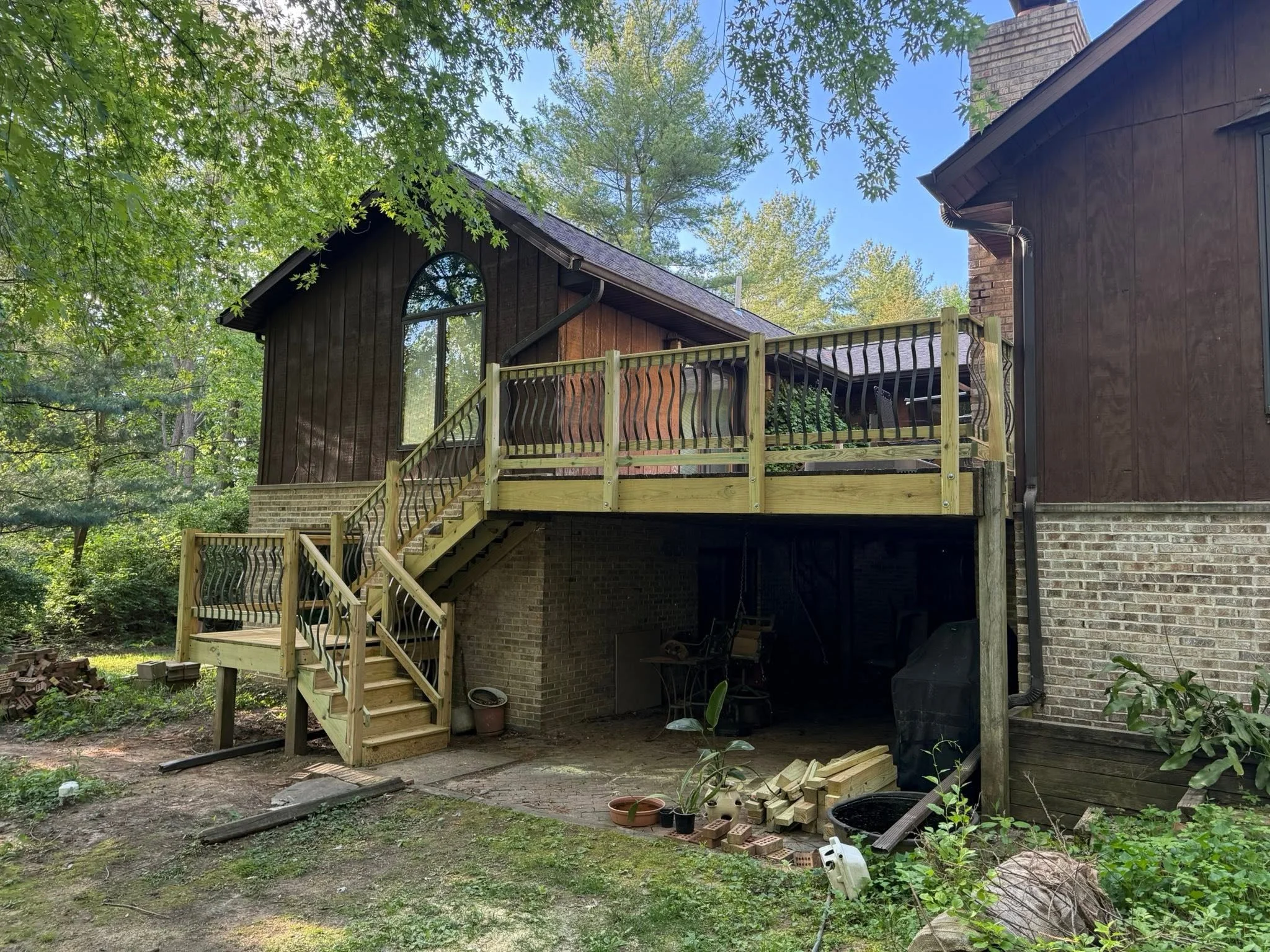 Deck railing and stairs rebuilt on the existing frame