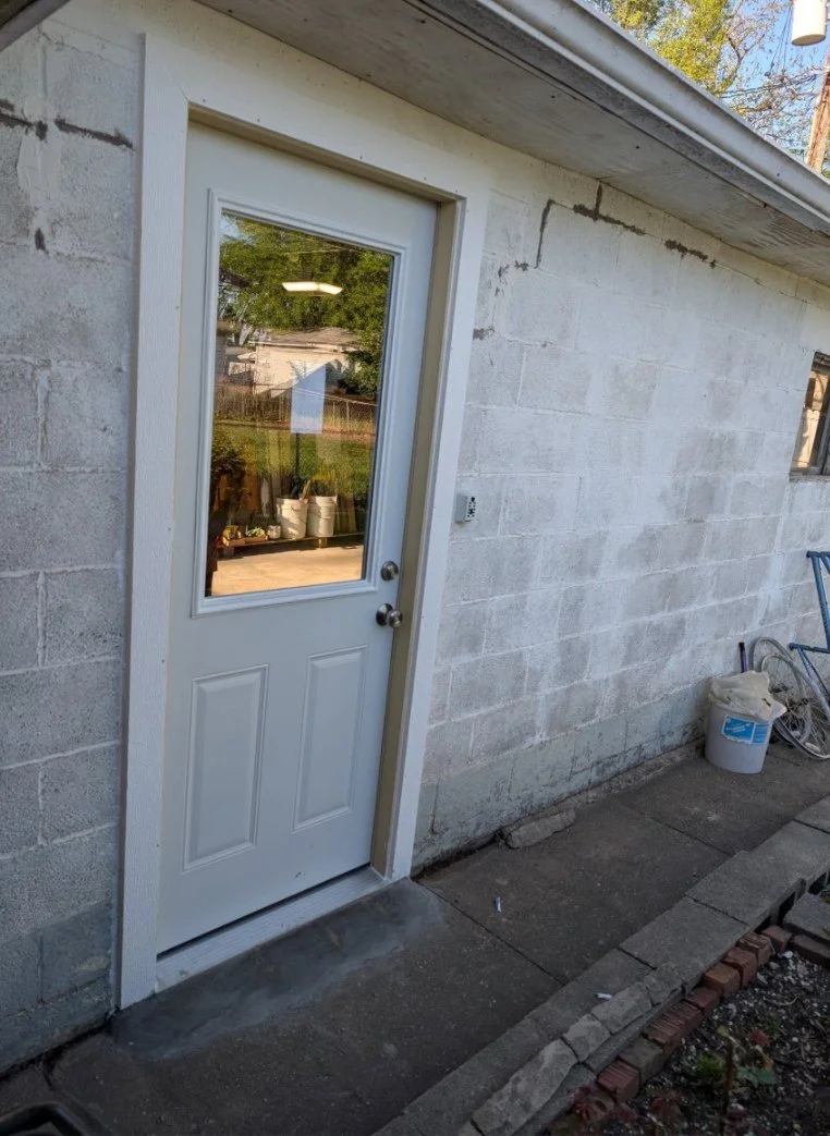 Man-door replaced in a masonry wall