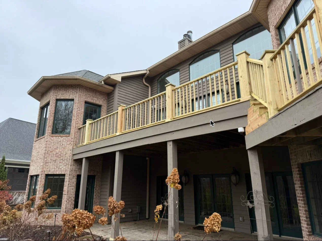 Elevated deck rebuild — new railings on the existing frame