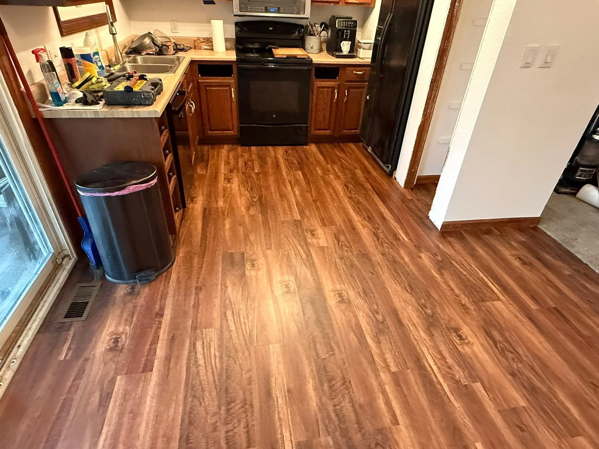 Plank flooring run through the kitchen