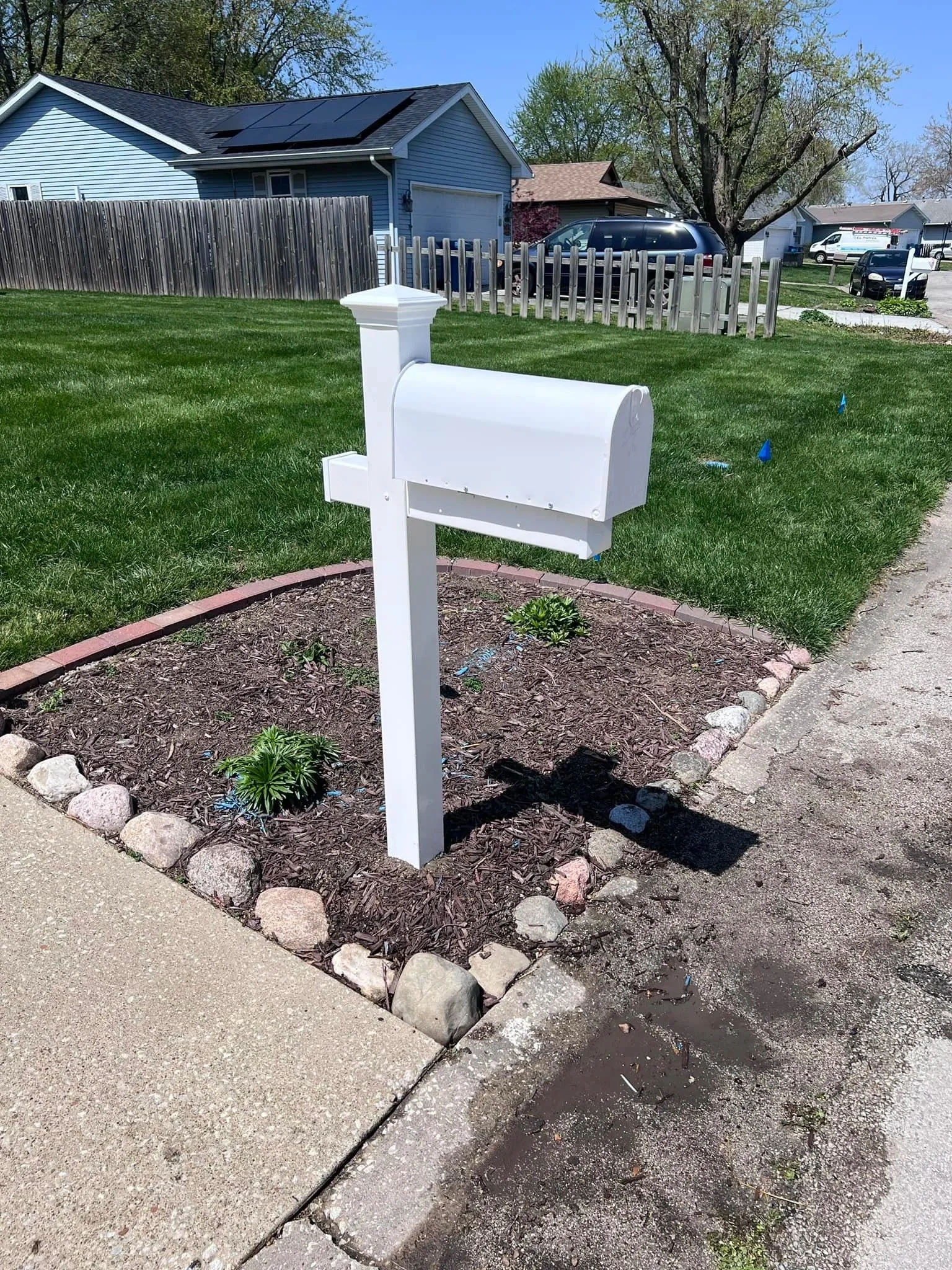 Mailbox post replaced and reset in concrete