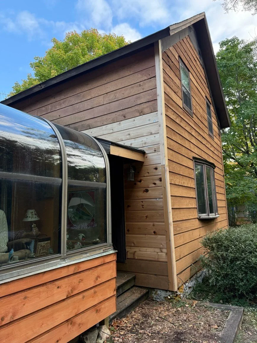 Wood siding on an older home, milled to match the existing profile.