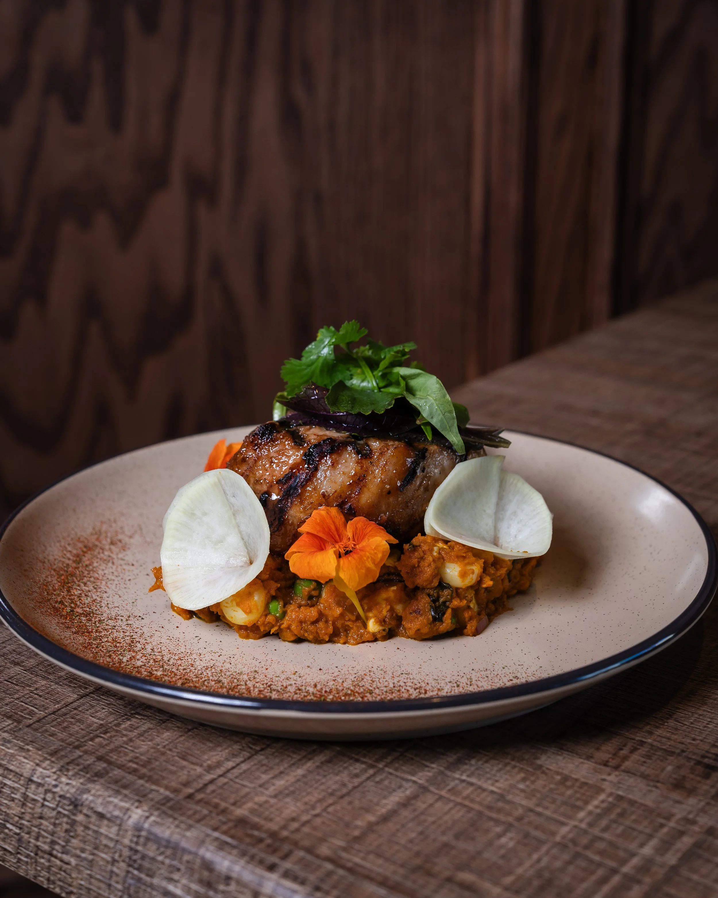 Our delicous Peruviet porkchop, 16 oz bone in pork chop that has been sous vide and grill both sides to get the tenderness and charcoal flavors. serve with pumpkin puree