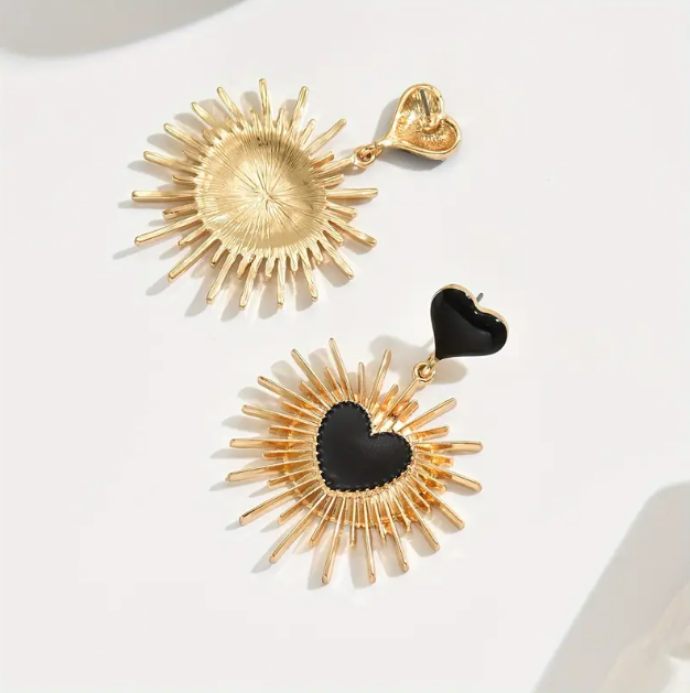 Make a bold fashion statement with Mozzimo Jewelry’s Gold Plated Sunburst Black Heart Dangle Earrings.