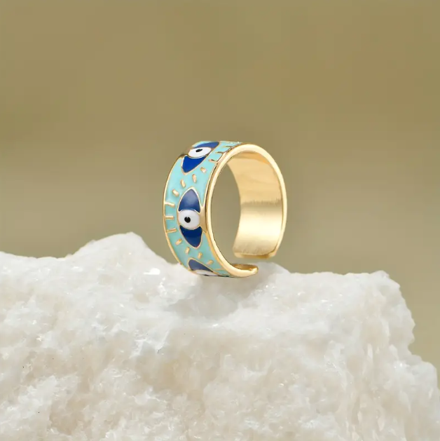 Discover the Gold Plated Thick Evil Eye Blue Enamel Adjustable Ring – a bold and stylish statement piece symbolizing protection and positivity.