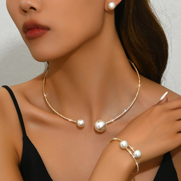 Drape yourself in timeless elegance with Mozzimo Jewelry’s 4 piece pearl and rhinestone choker set—sleek, sophisticated, and irresistibly chic.