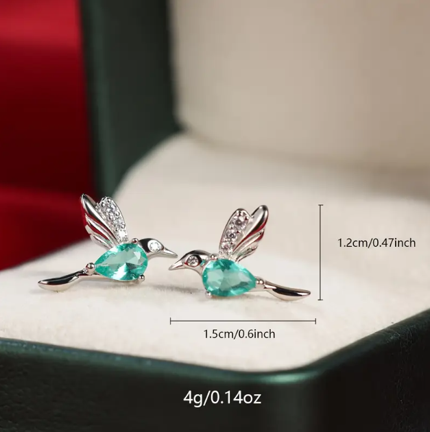 Add a playful pop of color with Mozzimo Jewelry's Sterling Silver Turquoise Gemstone Mini Hummingbird Earrings – elegant, lightweight, and nature-inspired.