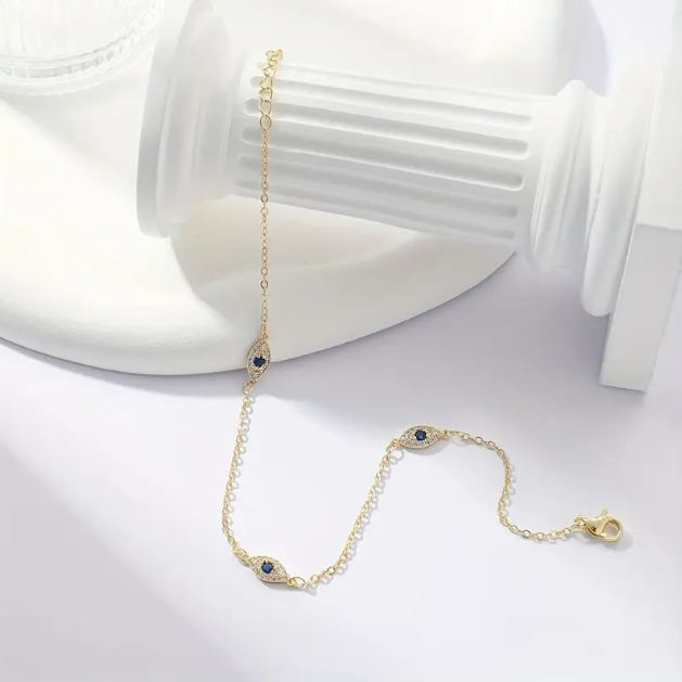 Shop Mozzimo Jewelry’s stylish gold-plated rhinestone Evil Eye anklet—beautifully crafted for protection, luck, and everyday elegance.