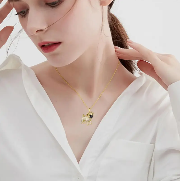 Discover Mozzimo Jewelry's charming gold-plated rhinestone pug pendant necklace—a delightful accessory for dog lovers everywhere.