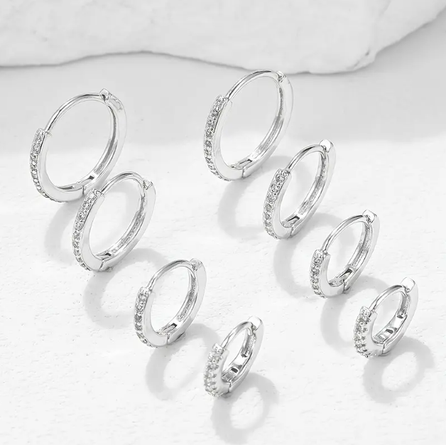 Discover the 8-Piece Sterling Silver Cubic Zirconia Rhinestone Mini Hoop Earrings Set, perfect for stacking, layering, and effortless elegance. Shop now at Mozzimo Jewelry!