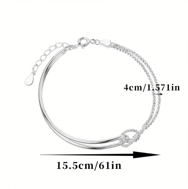 Explore the timeless elegance of the sterling silver fine knot hook clasp bracelet at Mozzimo Jewelry—perfect for adding a refined touch to any outfit.
