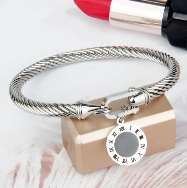 Elevate your wristwear with this sterling silver engraved rope bracelet featuring a black Roman numeral charm.