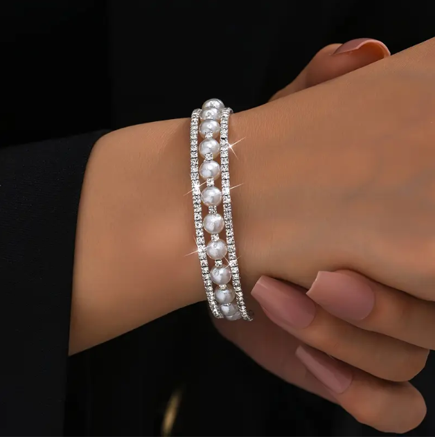 Elevate your elegance with Mozzimo Jewelry's Sterling Silver Thin Rhinestone Double Encrusted Pearls Bangle Bracelet – perfect for timeless, sophisticated style.