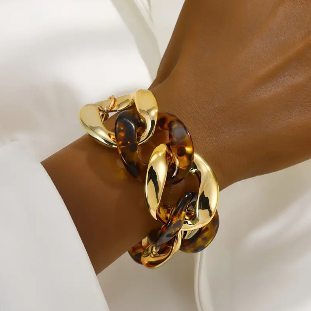 Make a bold statement with our Gold Plated Thick Tortoise Brown Weaved Chain Links Bracelet, a must-have trending piece.