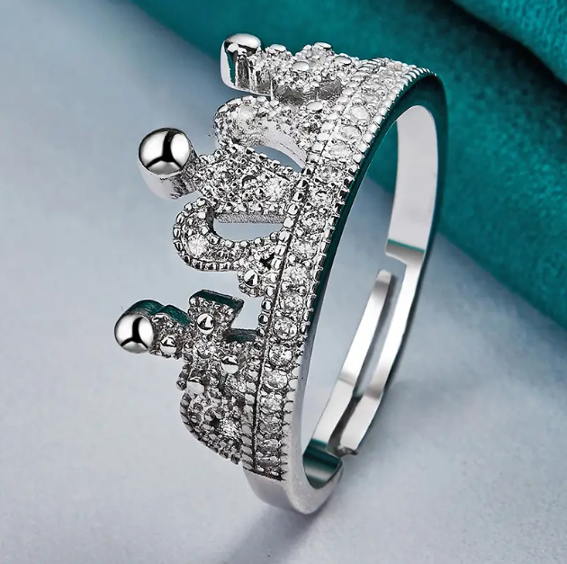 Add a royal touch to your style with the Sterling Silver Embossed Crown Adjustable One Size Ring from Mozzimo Jewelry. Shop now for elegant and timeless pieces.