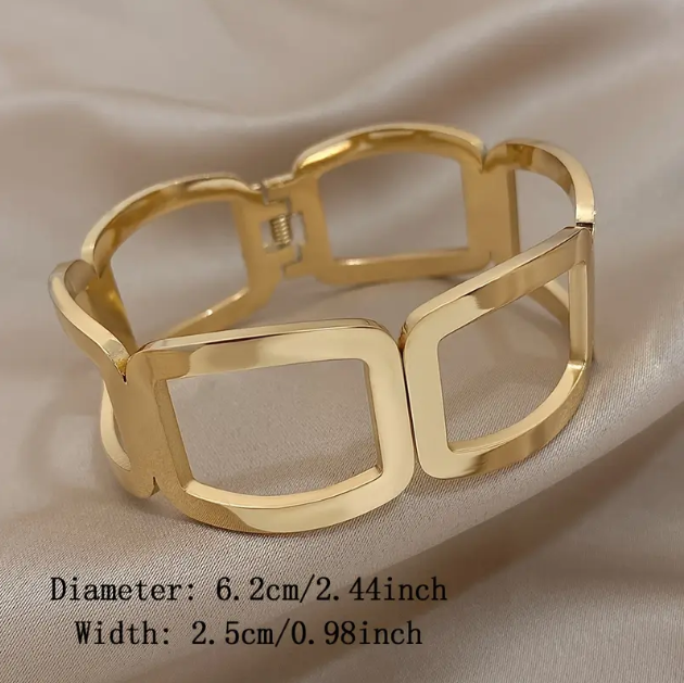 Elevate your style with Mozzimo Jewelry's Gold Plated Geometric Cutout Oversize Bangle Bracelet, a bold statement accessory for modern fashion lovers.
