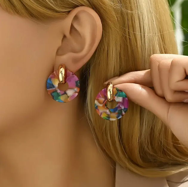 Make a statement with the Gold Plated Marble Acrylic Hoops and Circle Earrings, a stylish mix of gold-plated elegance and marbled acrylic for a trendy, modern look.