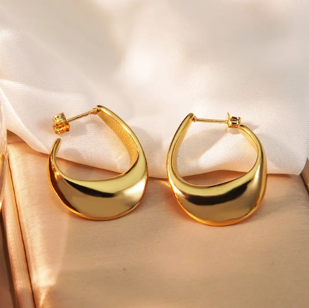 Make a bold statement with these Gold Plated Shiny Irregular Hoop Earrings—a sleek and modern twist on classic hoops with a high-polish finish.