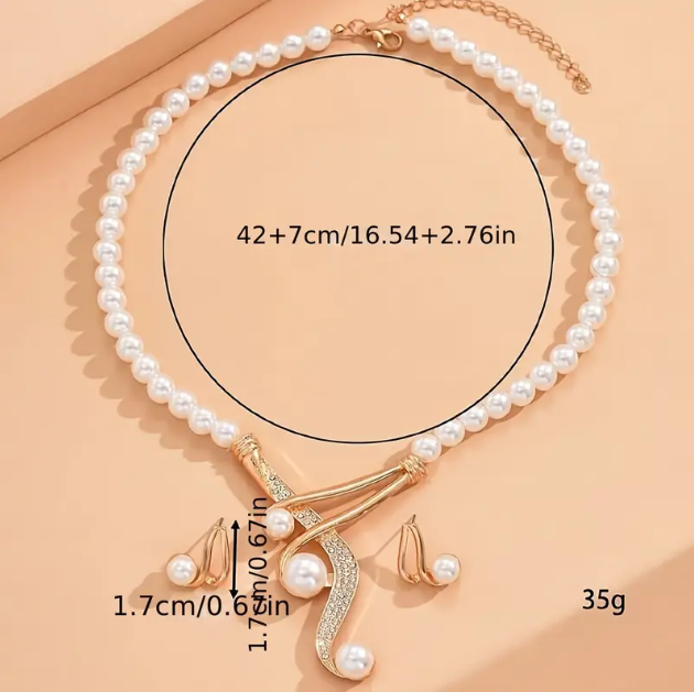 Enhance your style with the stunning 2 Piece Gold-Plated Faux Pearls Rhinestone Earrings and Necklace Set, a perfect combination of elegance and sparkle—available now at Mozzimo Jewelry.